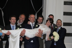 Best man, ushers/cousins lifting Sam off her feet